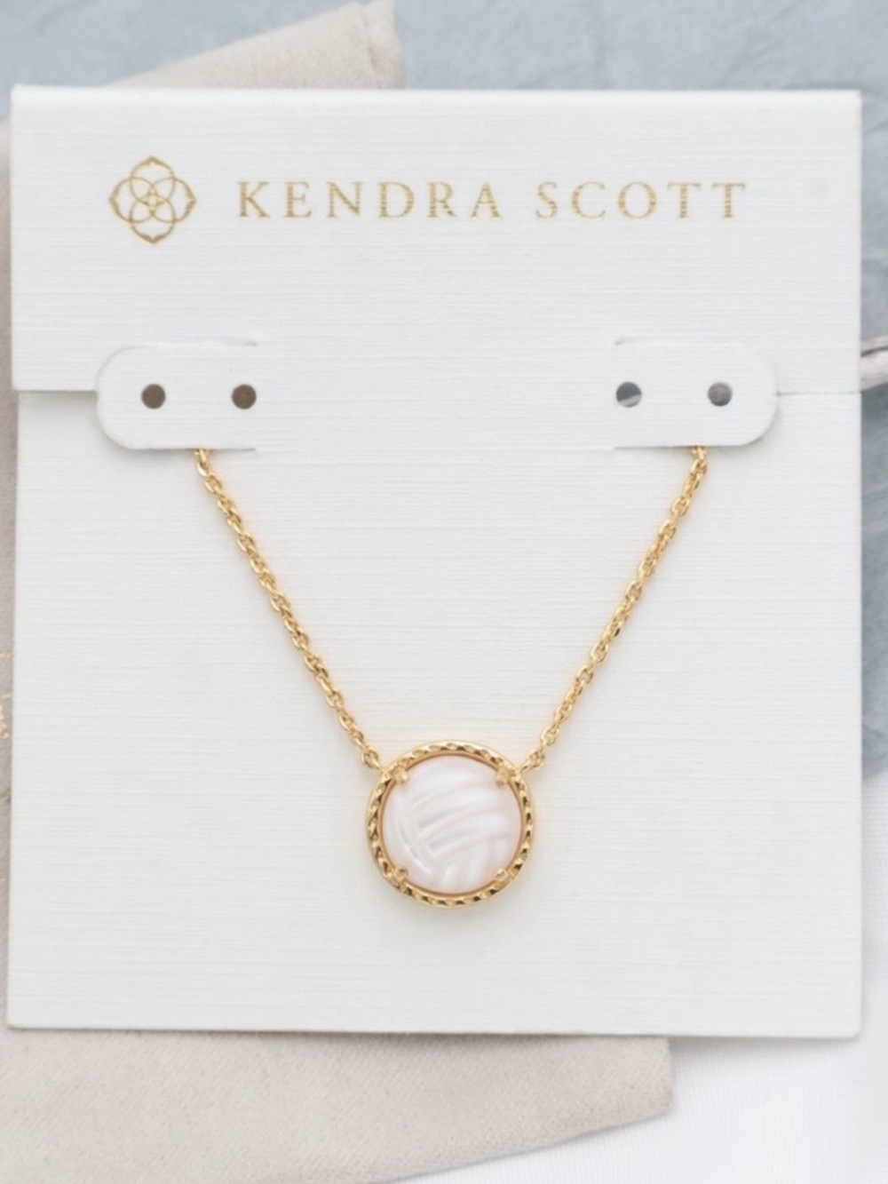 Kendra Scott Gold Necklace with Pink Mother-of-Pearl Volleyball Pendant